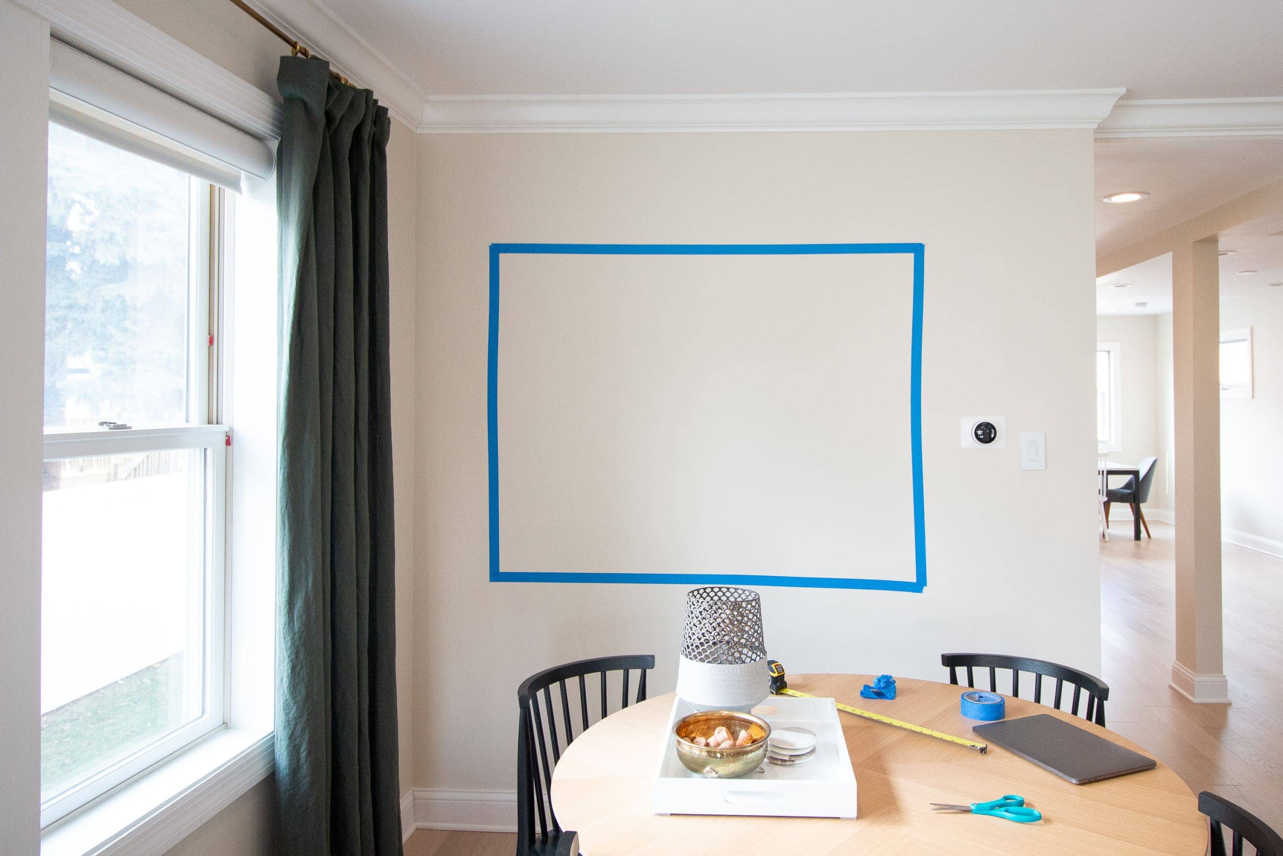 Tape out the wall when hanging a living room gallery wall 
