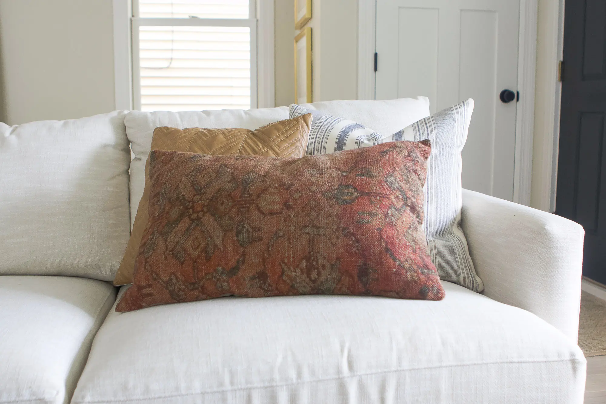 Adding colorful pillows to a neutral couch